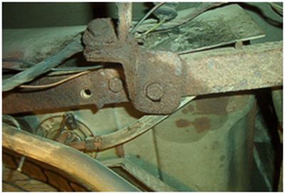 Bumper adjustment brackets being removed