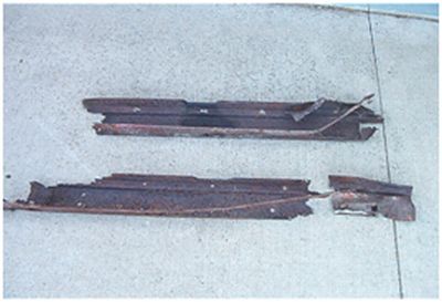 Rusted out rocker channels under the body