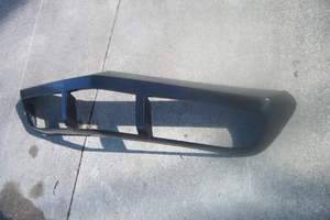 New fiberglass bumper cover beside the old urethane cover